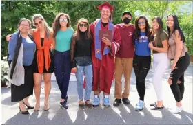  ?? ?? Goodrich Academy Class of 2022 senior Mathews Cardeal celebrated an early graduation on May 23 at the Fitchburg school surrounded by family including his father, mother, sister, and cousins.