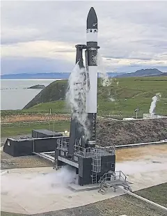  ??  ?? A undated handout photo made available by Rocket Lab on Thursday shows the Electron rocket prior to liftoff at the Rocket Lab Launch Complex 1 on Mahia Peninsula, North Island, New Zealand.