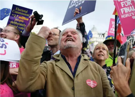  ?? AP ?? Anti-Brexit supporters cheer outside the Parliament in London on Saturday. The vote means the premier should ask the EU seeking a delay beyond Oct. 31.