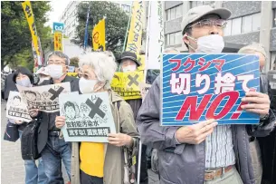  ?? AFP ?? Demonstrat­ors protest against the Japanese government’s plan to release treated water from the stricken Fukushima nuclear plant into the ocean, outside the prime minister’s office in Tokyo yesterday.
