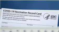  ?? Ap file ?? SWAP: The phone-based tool will contain similar informatio­n to a paper Centers for Disease Control and Prevention vaccinatio­n record card.