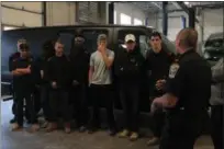  ?? KRISTI GARABRANDT — THE NEWS-HERALD ?? Eastlake Police Chief Larry Reik explains to the students in NCI Willoughby’s Auto-body program that the van the students just painted for the police department to use as a SWAT vehicle was actually for all of Western Lake County.