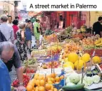  ??  ?? A street market in Palermo