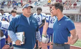  ?? ?? Payton (James, left) signs on to help Coach Troy (Taylor Lautner) and the lowly Warriors in the Netflix sports comedy.