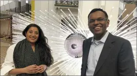  ?? ?? Artist Suchi Reddy, left, and Swami Sivasubram­anian, VP of Amazon Machine Learning at Amazon Web Services, in front of the interactiv­e artwork “me + you” in Washington, D.C.