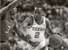  ?? Brad Tollefson / Associated Press ?? Texas coach Shaka Smart is urging the mellow Matt Coleman (2) “to play with reckless abandon” during his senior season.