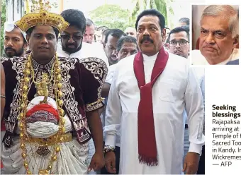  ?? — AFP ?? Seeking blessings: Rajapaksa (right) arriving at the Temple of the Sacred Tooth Relic in Kandy. Inset: Wickremesi­nghe.