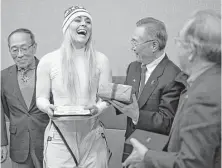  ?? Felipe Dana / Associated Press ?? Lindsey Vonn shows her joy after receiving gifts and a letter of appreciati­on for her grandfathe­r’s service during the Korean War from members of the Yongsan Club in Jeongseon, South Korea.