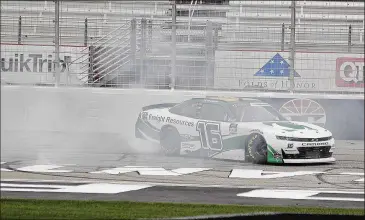  ?? BRYNN ANDERSON / ASSOCIATED PRESS ?? A.J. Allmending­er, a road-course specialist, celebrates his first win on an oval track Saturday evening in the NASCAR Xfinity Series race at Atlanta Motor Speedway in Hampton.
