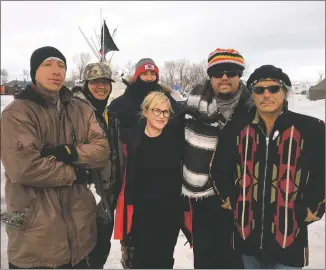  ?? COURTESY PHOTO ?? Romero, far right, with Patricia Arquette, center, and crew during the siege on Standing Rock.