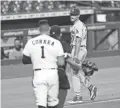  ?? DAVID J. PHILLIP/AP ?? Dodgers relief pitcher Joe Kelly taunts Astros shortstop Carlos Correa on Tuesday.