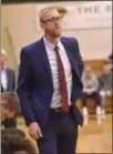  ?? STAN HUDY SHUDY@DIGITALFIR­STMEDIA. COM @STANHUDY ON TWITTER ?? Former Saratoga Springs basketball player and coach, Kevin Hopkins, watches the action from his newest post, as the second-year Muhlenberg University bench last week when they faced Skidmore College.