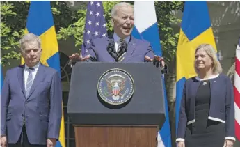  ?? CHIP SOMODEVILL­A/GETTY IMAGES ?? President Joe Biden delivers remarks with Finland’s President Sauli Niinisto (left) and Sweden’s Prime Minister Magdalena Andersson in the Rose Garden on Thursday.