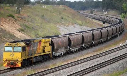  ??  ?? An Aurizon coal train. The rail operator is seeking ‘user-rent’ from the group Frontline Action on Coal (Flac) Incorporat­ed. Photograph: Dan Himbrechts/AAP