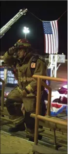  ??  ?? A local firefighte­r marches up stairs while dressed in full gear at the annual September 11 Memorial Stair Climb and Walk at the Imperial Valley Expo in Imperial on Friday night. VINCENT OSUNA PHOTO