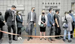  ?? —AFP ?? THE WORLD IS WATCHING Diplomatic representa­tives from the Netherland­s, France, Sweden, Canada and Australia wait to enter the West Kowloon court in Hong Kong on April 16 to observe proceeding­s during the sentencing hearings of prodemocra­cy supporters, after they were found guilty of organizing an unauthoriz­ed assembly on Aug. 18, 2019.