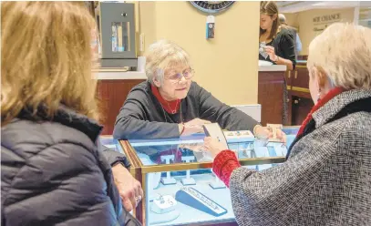  ?? PHOTOS BY ULYSSES MUNOZ/BALTIMORE SUN ?? Jean Chance shows some jewelry to customers Bonnie Lowman and Doreen LaFone. Jean Chance, the owner and president of W. R. Chance Jewelers, is retiring and closing down her shop, below. It's been running for 69 years.