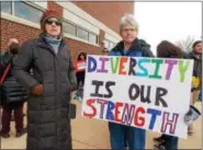  ?? LISA MITCHELL - DIGITAL FIRST MEDIA ?? Hamburg resident Lori Peters and Fleetwood resident Brydee Farmer were among the Berks County community members to join the Solidarity March on the Kutztown University campus on Feb. 16.