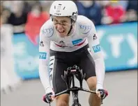  ?? Christophe Ena / Associated Press ?? Slovenia's Tadej Pogacar crosses the finish line of the fifth stage of the Tour de France, an individual time-trial over 16.9 miles. He averaged 32 mph and picked up big chunks of time on the other main contenders.