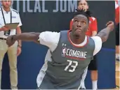  ?? ASSOCIATED PRESS ?? Former Wisconsin player Nigel Hayes participat­es in the running vertical jump at the NBA draft combine.