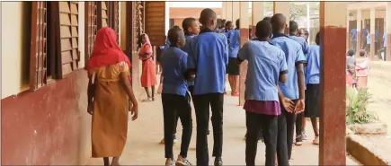  ?? Photo: Nampa/AFP ?? Greatest equaliser… Pupils of Tsinga Bilingual High School walk around the schoolyard during break time in Yaounde.