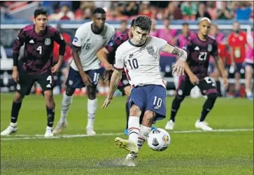  ?? Jack Dempsey Associated Press ?? CHRISTIAN PULISIC, delivering a penalty kick for a goal against Mexico in Denver, cleared COVID-19 protocols and was among 16 players who started training with the U.S. team Monday at Lipscomb University.