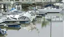  ?? Picture: Nicci Hayes ?? EXPENSIVE BUSINESS: Three boats sank in the Port Alfred Marina after their covers were ripped off in near gale-force winds on Sunday nights and they filled with water.