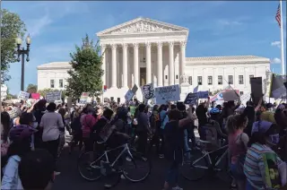  ?? Jose Luis Magana / Associated Press ?? Demonstrat­ors march outside of the the U.S. Supreme Court during the Women's March in Washington on Saturday.