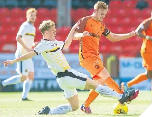  ??  ?? Sam Wardrop of Dumbarton and United’s Fraser Fyvie fight for the ball.