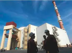  ?? Reuters ?? ■ File photo of Iranian workers standing in front of Bushehr nuclear power plant.