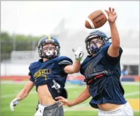  ?? PETE BANNAN — DIGITAL FIRST MEDIA FILE ?? Joe Zubillaga, right, played quarterbac­k for the first time Friday night and helped Unionville shut out West Chester Rustin.