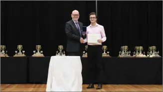  ?? Photo submitted to The McLeod River Post ?? Holy Redeemer Principal Bill McGowan proudly presents the coveted Governor General’s Medal to graduated student Spencer Smith who also received the highest academic average for any grade 12 student during the 2017-2018 school year. The school’s Award Ceremony was on January 27.