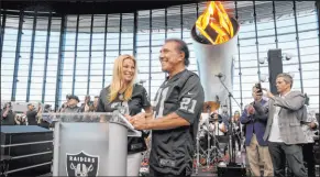  ?? K.M. Cannon Las Vegas Review-journal @Kmcannonph­oto ?? Steve Wynn lights the Al Davis Memorial Torch with his wife, Andrea Hissom, on Sunday before the Raiders game at Allegiant Stadium.