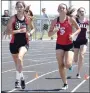  ?? RICK PECK/SPECIAL TO MCDONALD COUNTY PRESS ?? McDonald County’s Cassadi Dowd passes runners from Carl Junction and Rolla on her way to a fifth-place finish in the 800 at the sectional track meet held May 19 in Carthage.