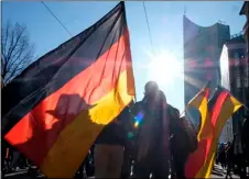  ?? DPA VIA AP
SEBASTIAN KAHNERT/ ?? People wave German flags as they take part in a demonstrat­ion against coronaviru­s restrictio­ns in Leipzig, Germany, on Saturday.