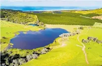  ??  ?? Most of the aerial view, left, encompasse­s the 500ha Muriwai Downs Farm. The property includes the 5ha Lake Okaihau, above.