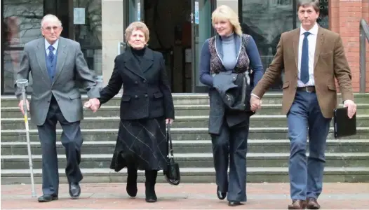  ??  ?? Cleared: Kenneth Hugill, left, with his wife Sheila and their daughter-in-law Sally and son David outside court yesterday