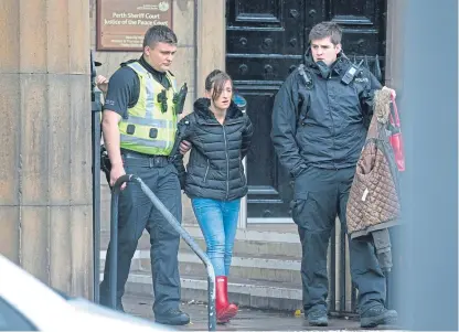 ??  ?? Darlene Mullen being led away after being arrested for stealing a jacket from Primark while on her way to Perth Sheriff Court.