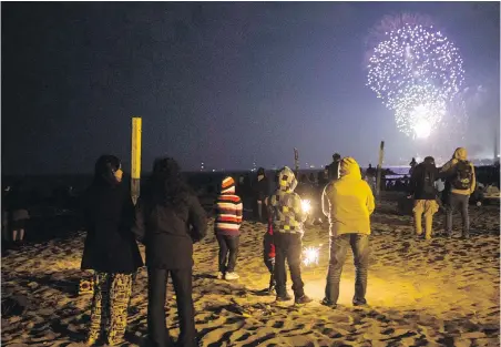  ??  ?? For the Victoria Day weekend, many cities and towns in Canada have banned the sale of fireworks to discourage large groups coming together to watch them. Others are allowing people to set them off if only small groups are present.