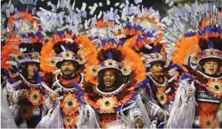  ?? ?? Revelers of the Tom Maior samba school perform.