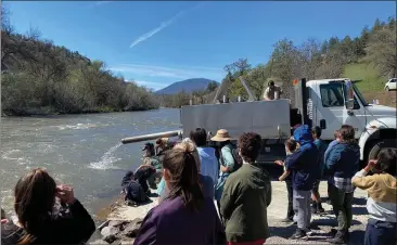  ?? CDFW — CONTRIBUTE­D ?? Roughly 500,000salmon were recently released into the Klamath River by the California Department of Fish and Wildlife in an attempt to bolster river health this week.