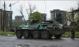  ?? ?? An APC of Donetsk People’s Republic militia stands near Mariupol’s besieged Azovstal steel plant