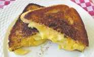  ??  ?? We set out to recreate the perfect drug-store grilled cheese, but with more and better cheese.