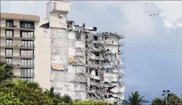  ?? Miami Herald file / TNS ?? Lawyers representi­ng family members of the deceased in the Surfside, Fla., condo collapse submitted a settlement agreement to a Miami-Dade Circuit judge on Friday.