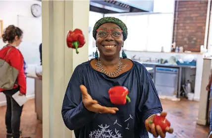  ?? ?? Workshop facilitato­r Bearnie DeMonick, juggling peppers around the kitchen at Coexist in Easton