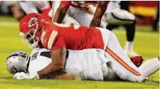  ?? Rich Sugg/TNS ?? Chiefs defensive end Chris Jones’ sack of Derek Carr last Monday elicited another roughing-the-passer outcry.