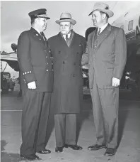  ?? THE COMMERCIAL APPEAL FILES ?? Arriving at Municipal Airport from Washington, Representa­tive Clifford Davis (Center) was welcomed by a committee headed by Fire Chief John C. Klinck (Left) and Commission­er Claude Armour. Mr. Davis will address the National Fire Department Instructor­s Conference on 27 Apr 1953. He was instrument­al in bringing the conference to Memphis.