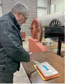  ??  ?? G5 project engineer David Elliott cutting his 70th birthday cake. G5