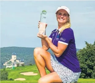  ??  ?? Perthshire’s Carly Booth with the Tipsport Czech Ladies Open trophy.