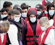  ?? ?? A group of males being brought to Dover on a UK Border Force vessel following an incident in the English Channel (archive photo)